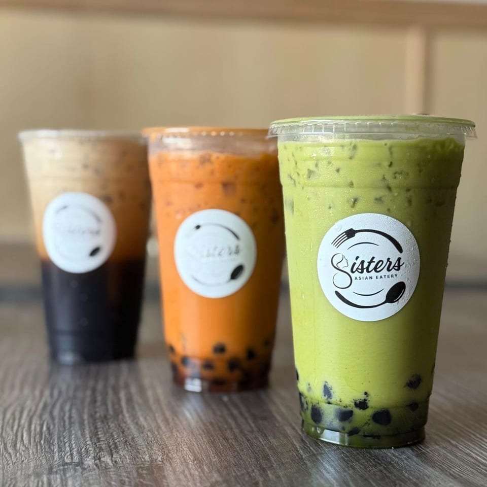 Three Sisters Asian Eatery bubble tea drinks: black, orange Thai, and green matcha.