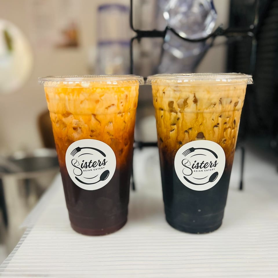 Two Sisters Asian Eatery Thai iced teas with distinct layers of dark tea and creamy orange.